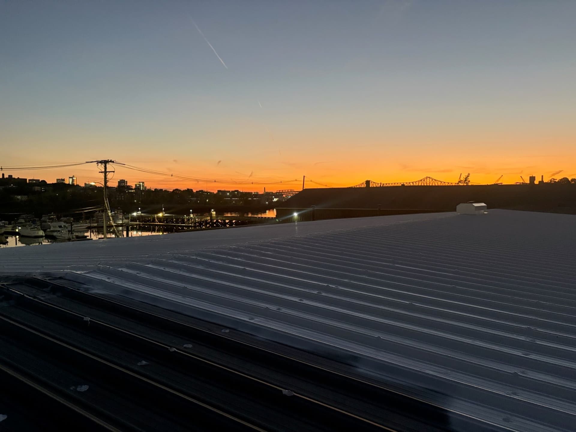 Breathtaking Sunset Over a Metal Roof in Boston image