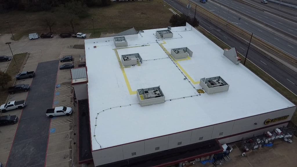 Project Smooth and Durable Silicone Roof with Yellow Walk Paths image